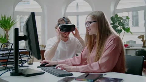 Young and Attractive Couple Work on Virtual Reality Project. Positive Team Work. Stock Footage 131029440
