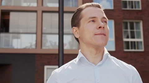 Young and attractive freelancer walking outdoor. Office worker or businessperson Stock Footage 144429882