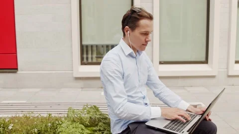 Young and attractive freelancer working outdoor. Office worker or businessperson Stock Footage 137773271