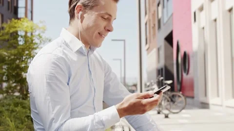 Young and attractive freelancer working outdoor. Office worker or businessperson Stock Footage 137807932
