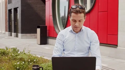 Young and attractive freelancer working outdoor. Office worker or businessperson Stock Footage 144429856