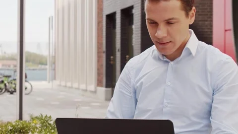 Young and attractive freelancer working outdoor. Office worker or businessperson Stock Footage 308241522