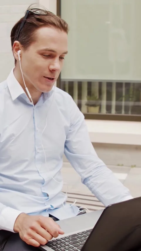 Young and attractive freelancer working outdoor. Office worker or businessperson Stock Footage 308481013