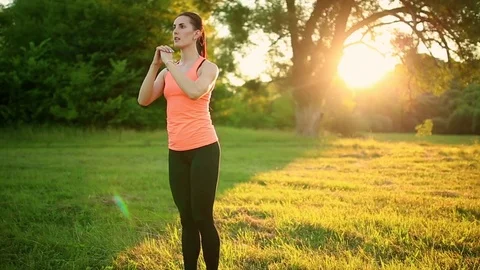 Young and attractive womans doing fitness exercises in park Stock Footage