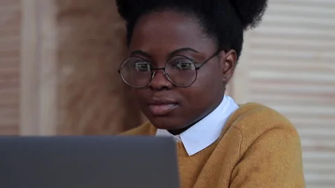 Young and beautiful black millennial age in the home office working on the compu Stock Footage 148566745