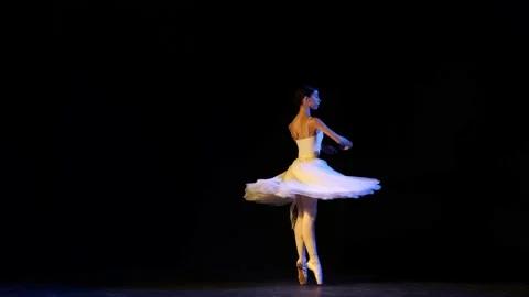 Young and beautiful graceful classical ballet female dancer in white dress Stock Footage 211997695