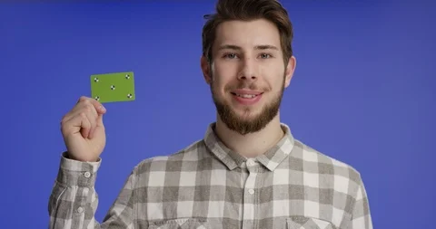 Young and confident man presenting buisness card Video stock 99459264