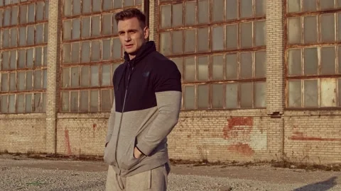 Young and fit man having evening workout outdoor. Urban sunset background Stock Footage 142018485