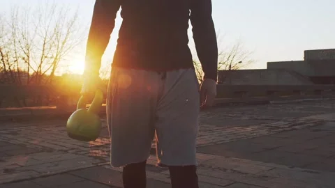 Young and fit man having evening workout outdoor. Urban sunset background Stock Footage 263109341