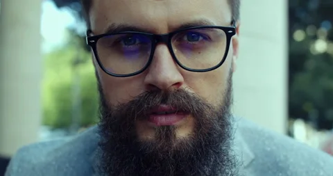 A young and handsome man, with a beard and glasses. Stock Footage 138812016