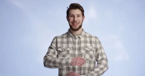Young and handsome man smiling and crossing his arms resolutely Stock-Footage 99415361