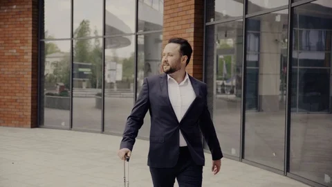 Young and handsome man walking down the street Stock Footage 129552716