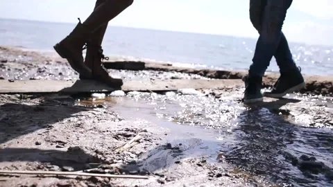 Young and lovers run along the shore Stock Footage 130949988