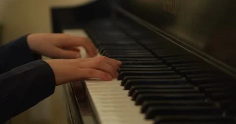 Young and old hands play piano- 4K Stock Footage 89825559