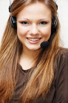 Young and pretty customer support woman with headset. Stock Photos