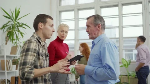 Young and senior men talking during mental health exercise Stock Footage 142289933