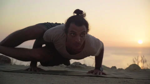 Young and Strong Man Doing Yoga and Balancing in Nature Sunset Stock Footage 137949904