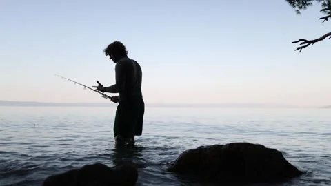 Young angler becomes disappointed because fish are not biting and there is no ca Stock-Footage 341622351