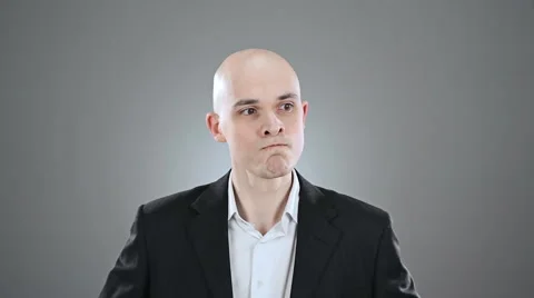 Young angry elegant bald man phone up isolated on white Stock Footage 64477038