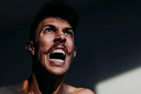 Young angry man expressing negative emotion Stock Photos
