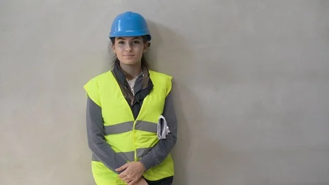 Young apprentice with security helmet, isolated on background Video stock 123214793