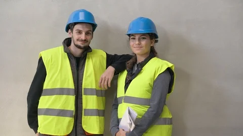 Young apprentice with security helmet, isolated on background Stock Footage 123214989