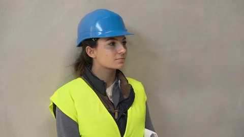 Young apprentice with security helmet, isolated on background Stock Footage 123215055