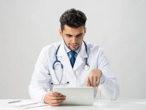 Young arab internist using tablet computer Stock Photos