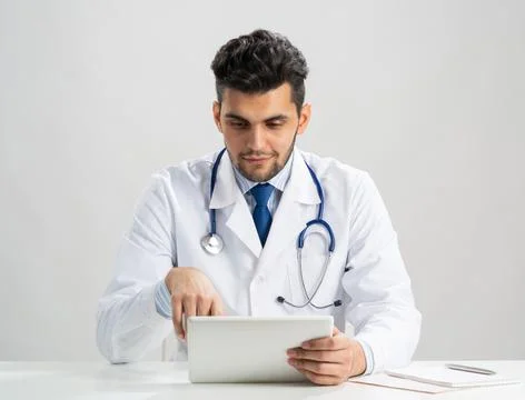 Young arab internist using tablet computer Stock Photos