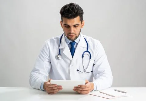 Young arab internist using tablet computer Stock Photos