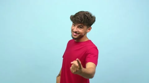 Young arab man inviting to come, confident and smiling, open arms to receive Stock Footage 138665205