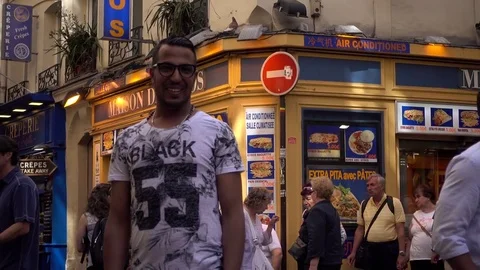 Young arab Man posing for Photo in Lqtin Quarter in Paris Stock Footage 76471559