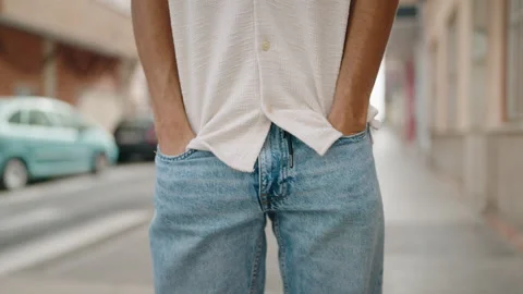 Young arab man showing empty pockets at street Stock Footage 202163376