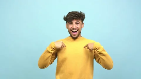 Young arab man surprised, feels successful and prosperous, is very lucky Stock Footage 138665339