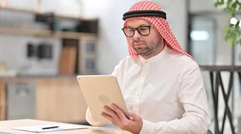 Young Arab Man Using Tablet Computer Stock Photos