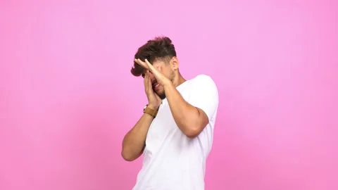 Young arab man very scared and afraid, desperate for something, covering mouth Stock Footage 138664279