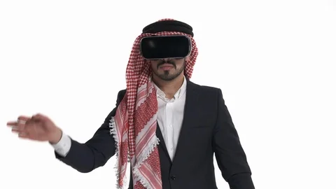 Young Arab man in virtual reality glasses touching virtual objects. VR, future, Stock Footage 125829678