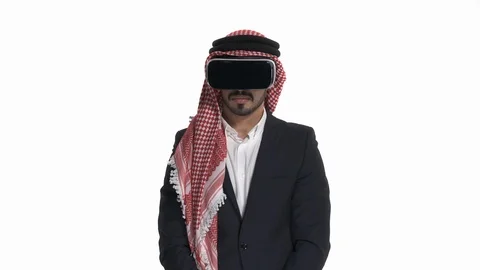 Young Arab man in virtual reality glasses imitating swimming, looking to the Stock Footage 125829734