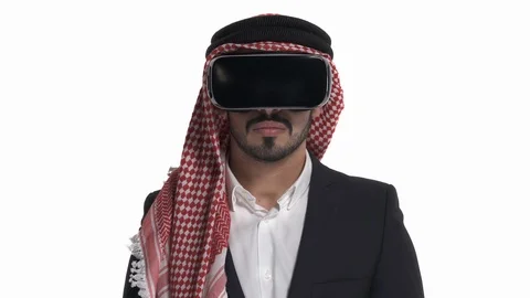 Young Arab man in virtual reality glasses drawing virtual lines. VR, future, Stock Footage 125831216