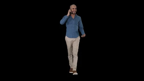 Young arab man walking and talking on the phone and smile, Alpha Channel 스톡 동영상 113617826