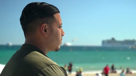 Young arab / middle easter man looking into horizon Stock Footage 78366709