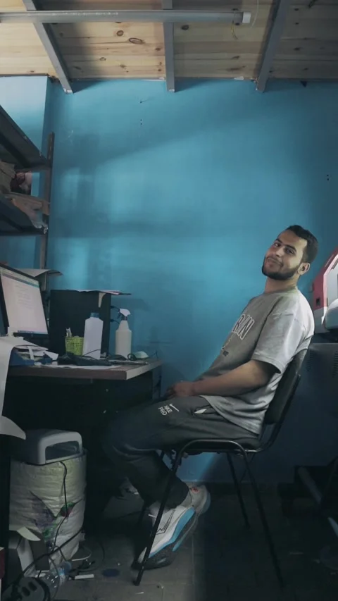 Young Arab Worker Smiling At Computer In Moroccan Print Shop Stock Footage 339427018