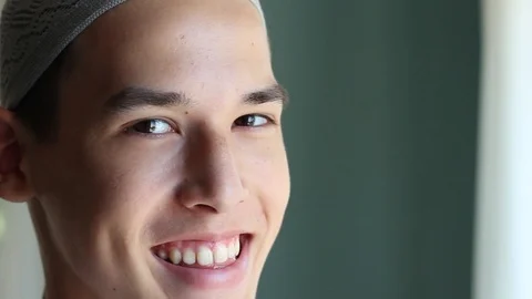 Young arabian man smiles. Eid al-Fitr Stock Footage 90961325