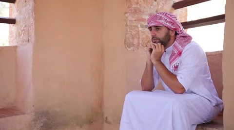 Young arabic man sitting and thinking about something Stock Footage 68620770