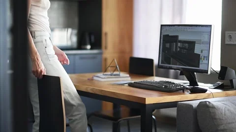 A young architect begins to work in the architectural program Stock Footage 130872905