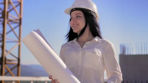 Young architect in helmet, engineer, designer, employee, white woman Stock Footage 240340283