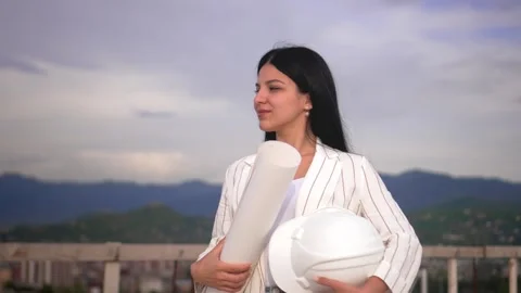 Young architect in helmet, engineer, designer, employee, white woman Stock Footage 240344464