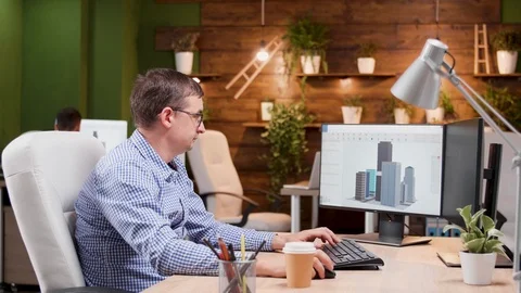 Young architect holding the model for a new skyscraper Stock Footage 115072176