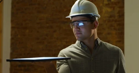 Young architect holding a tablet Video stock 116188542