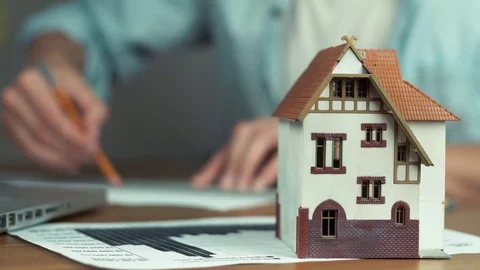 Young architect using pencil and metal ruler creating housing project Video stock 81881637